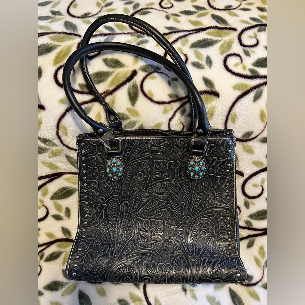 Black stamped conceal carry leather bag, gently used.